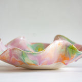 Multicoloured ceramic bowl on a white background
