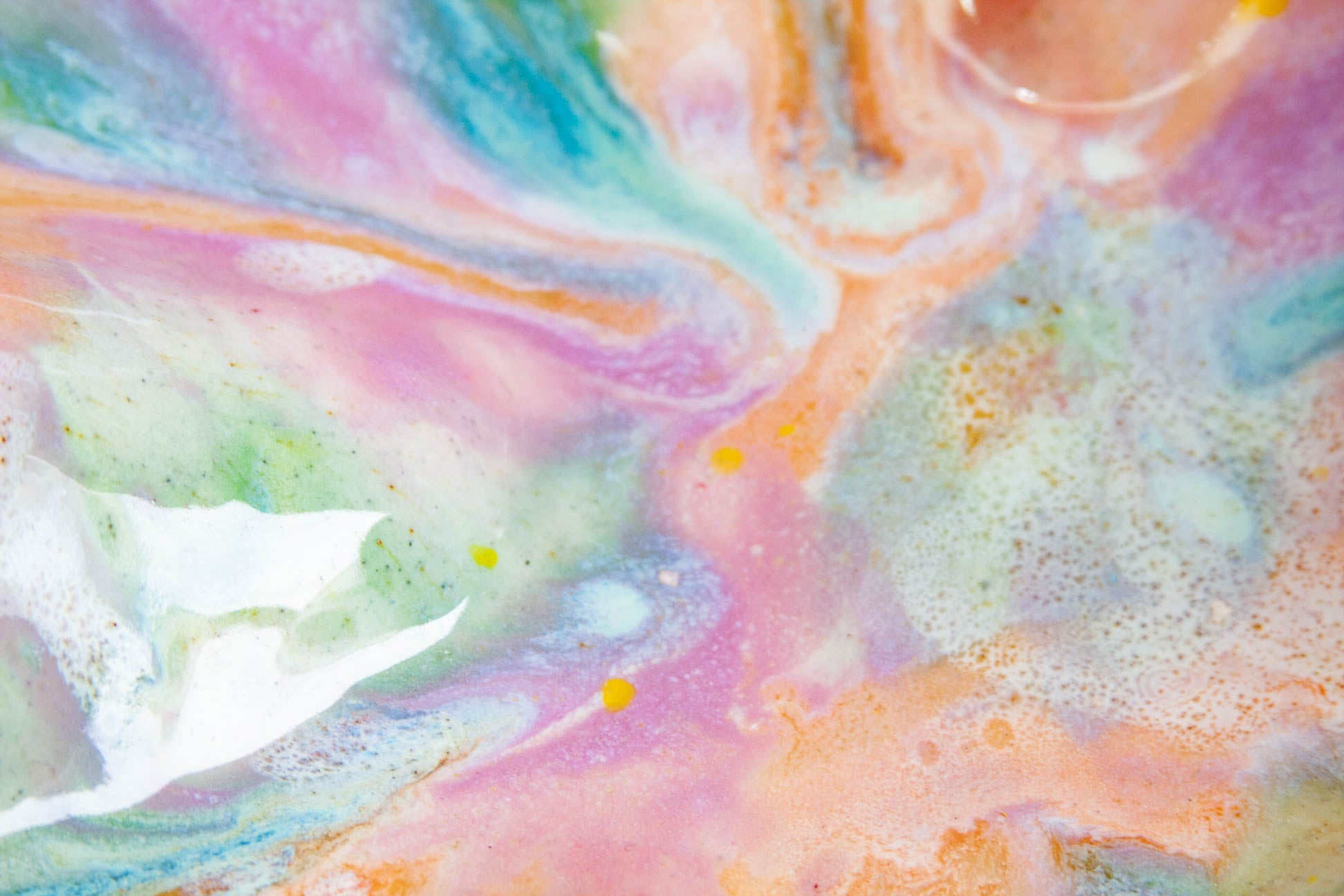 Colourful abstract art with pastel shades of pink, blue, green, and orange.