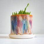 handmade ceramic planter, sitting on ceramic saucer