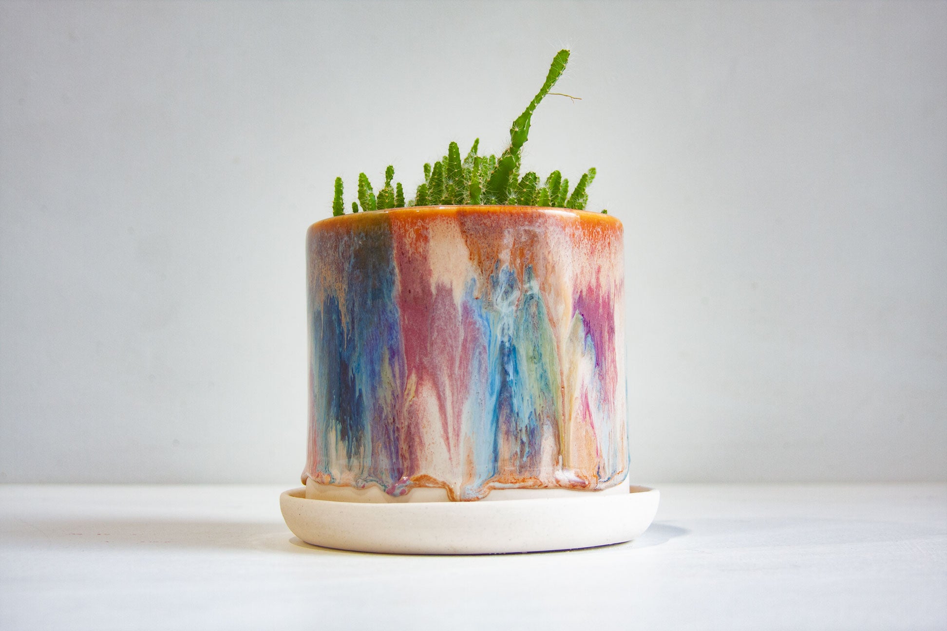 handmade ceramic planter, sitting on ceramic saucer