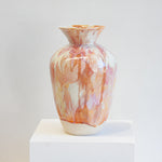 handmade ceramic large sculptural vase on a white plinth.
