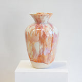 handmade ceramic large sculptural vase on a white plinth.