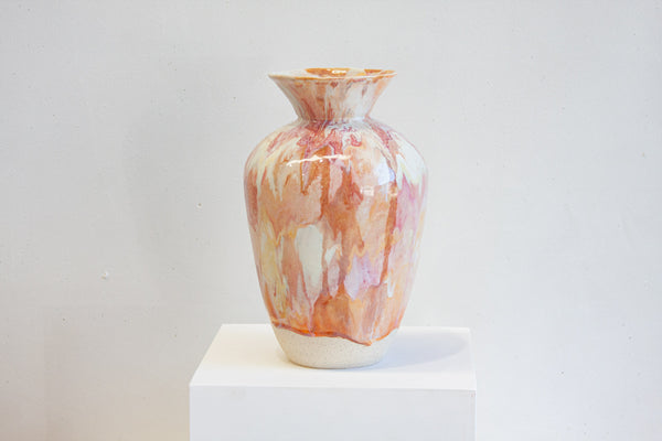 handmade ceramic large sculptural vase on a white plinth.