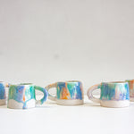 handmade ceramic blue, orange, light purple and green mug