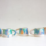 handmade ceramic blue, orange, light purple and green mug