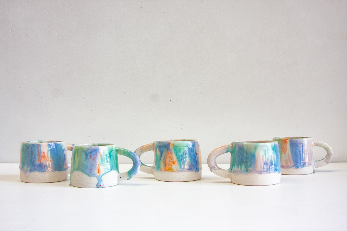 handmade ceramic blue, orange, light purple and green mug