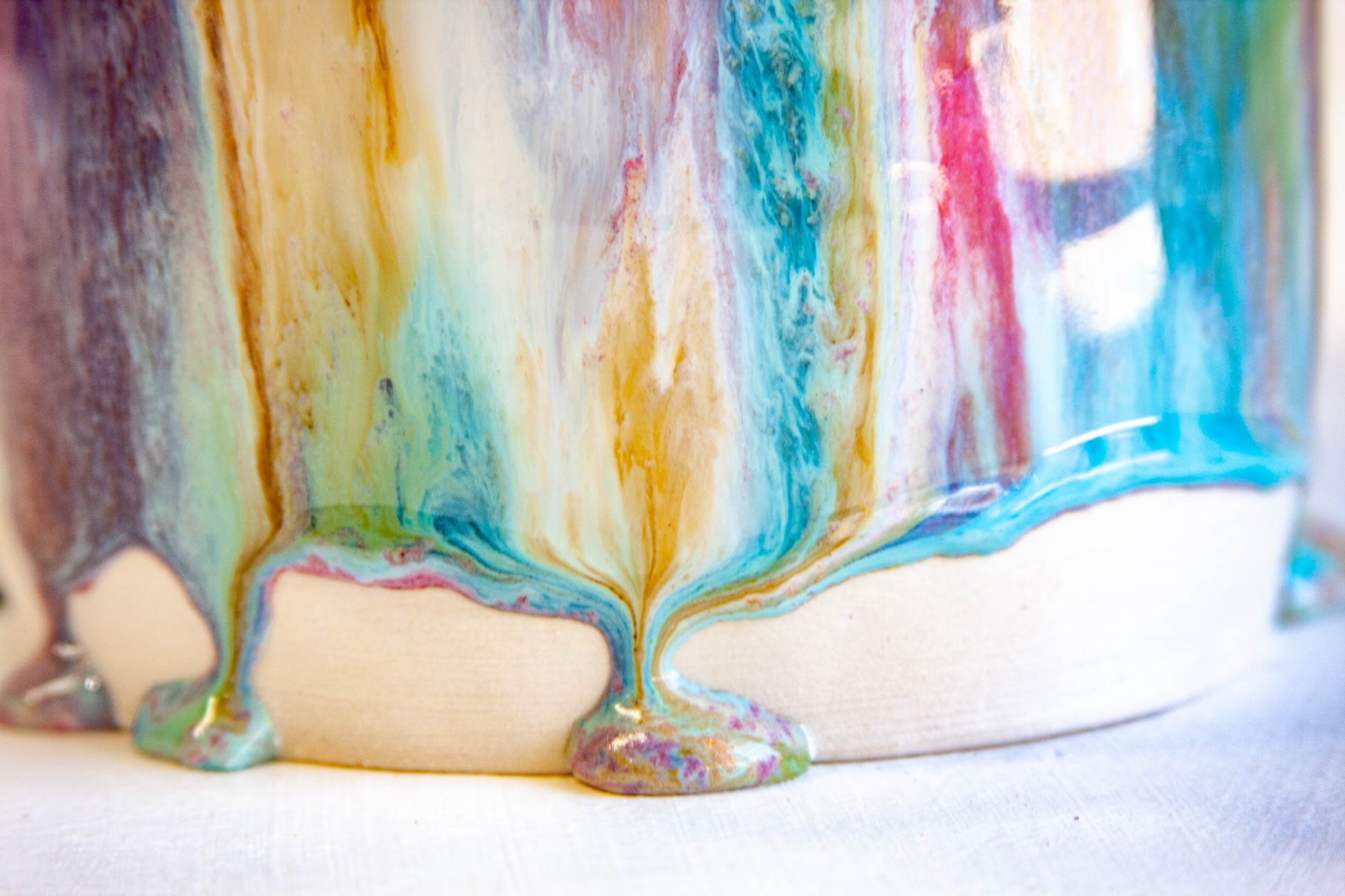 zoomed in photo of a glaze drip detail on handmade ceramic table lamp