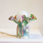 handmade ceramic table lamp shown on table