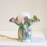 handmade ceramic table lamp shown on table