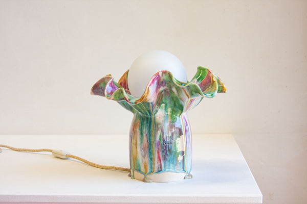 handmade ceramic table lamp shown on table