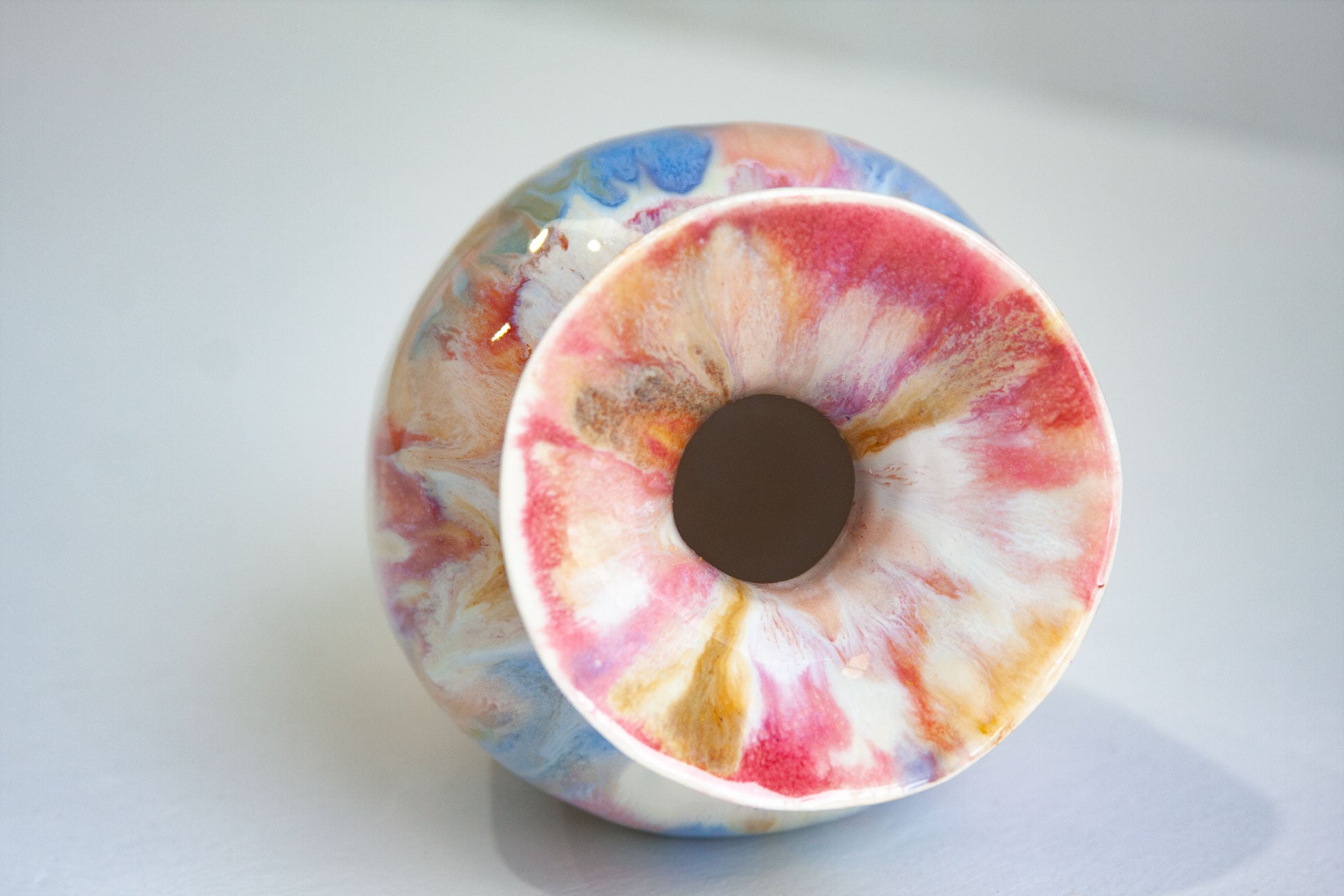 Colourful handmade vase on it's side