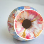 Colourful handmade vase on it's side