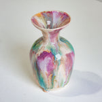 Multicolored ceramic vase on a white background