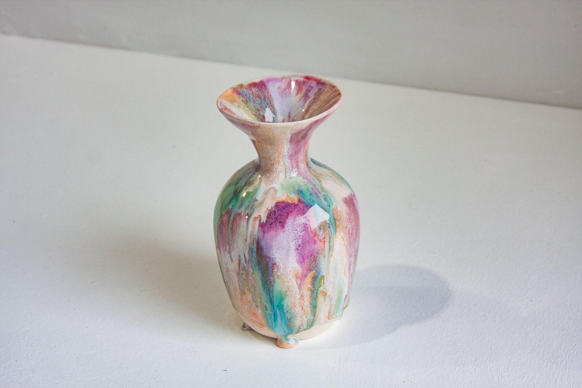 Multicolored ceramic vase on a white surface