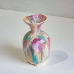 Multicolored ceramic vase on a white surface