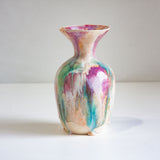 Multicolored ceramic vase on a white background