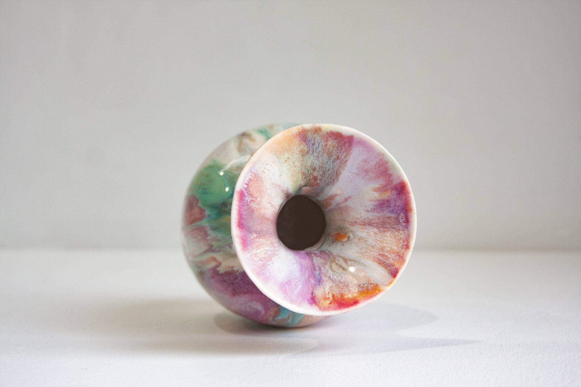 Colorful marbled ceramic bowl on a white background
