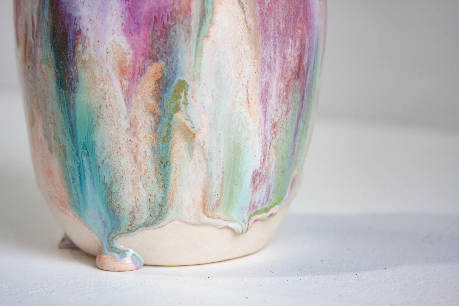 Multicolored ceramic vase on a light background