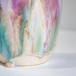 Multicolored ceramic vase on a light background