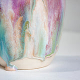 Multicolored ceramic vase on a light background