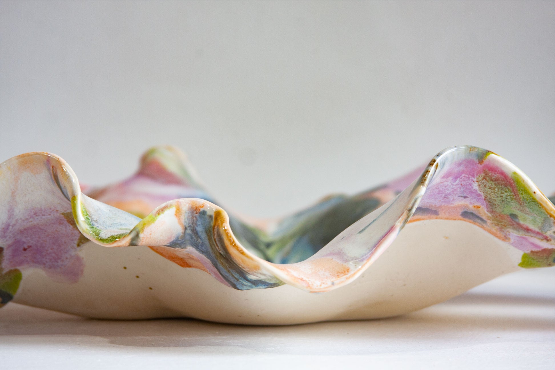 Multicolored ceramic platter on a light background