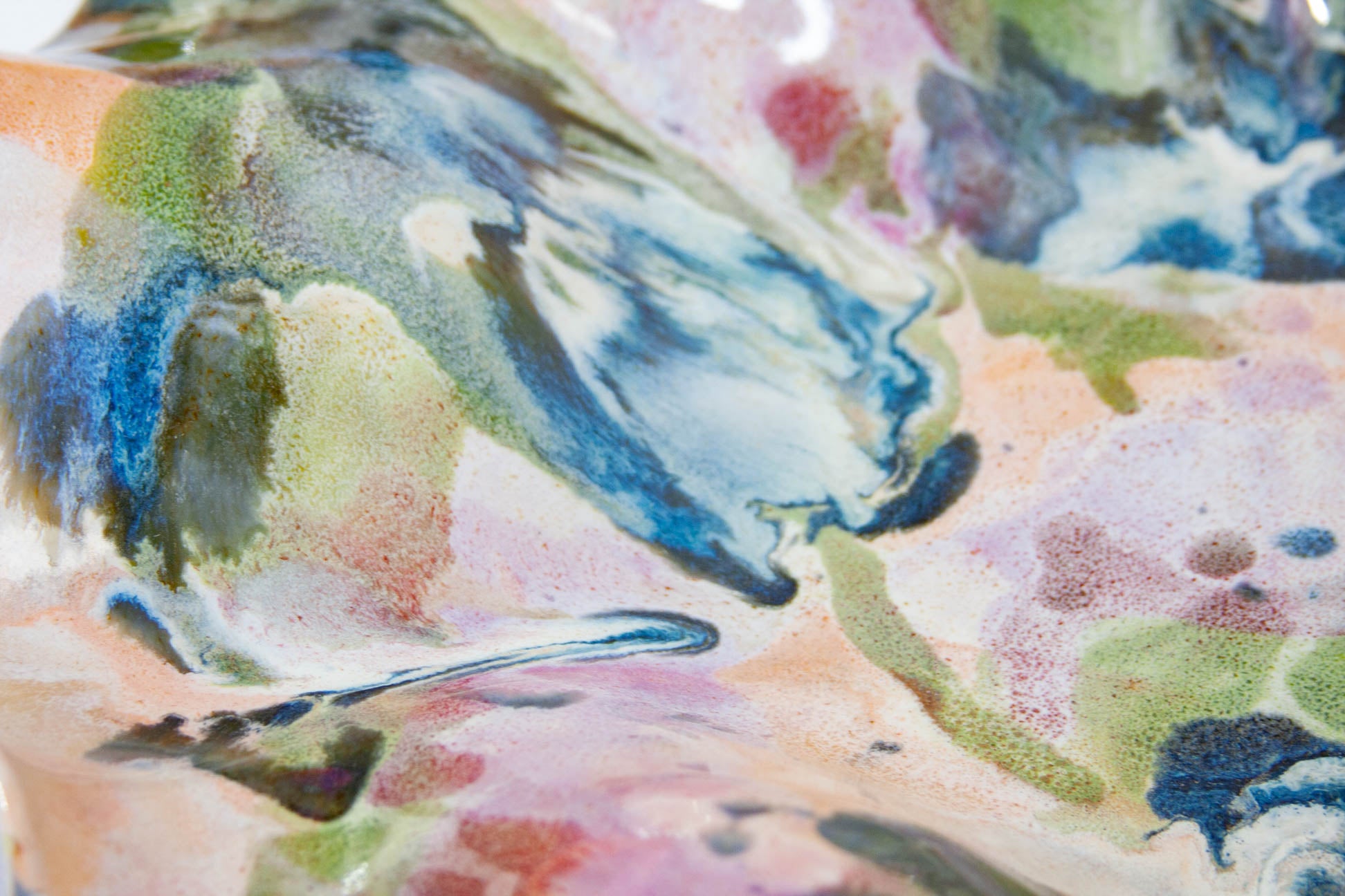 Close-up of a colorful abstract pattern with shades of blue, green, and pink.