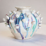 handmade sculptural vase with petal like attachments, multicoloured
