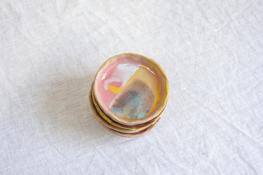 pink, blue yellow and white handmade ceramic small plate