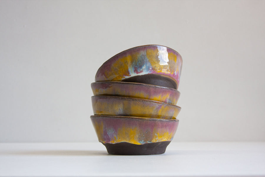 pink, blue and yellow handmade ceramic black clay bowl 